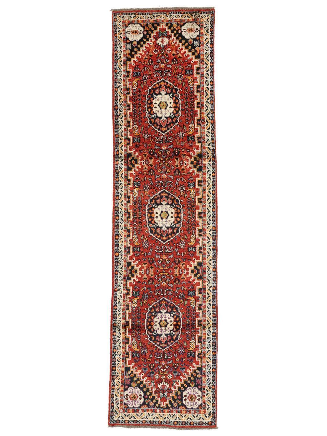 Red Afghan Kazak runner with geometric patterns