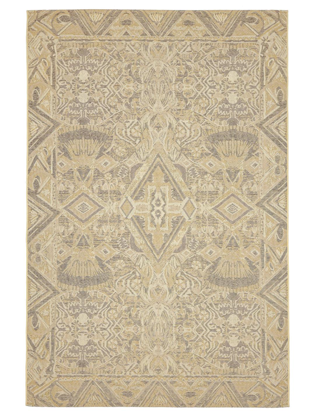 Een beige vloerkleed met een geometrisch tribaal patroon