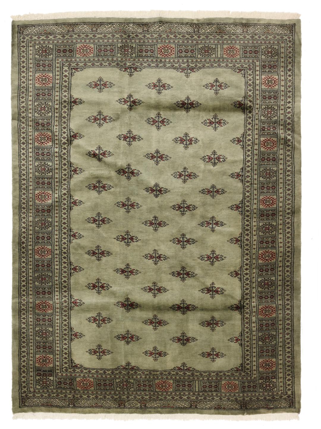 Handmade Pakistani rug in light-green with traditional motifs