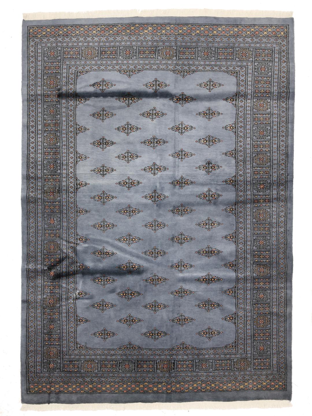 Handmade Pakistan wool rug in blue with traditional patterns