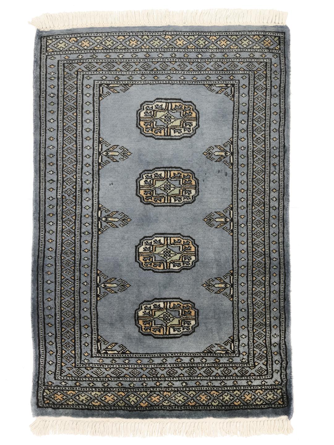Handmade Pakistan Bokhara blue rug with traditional motifs