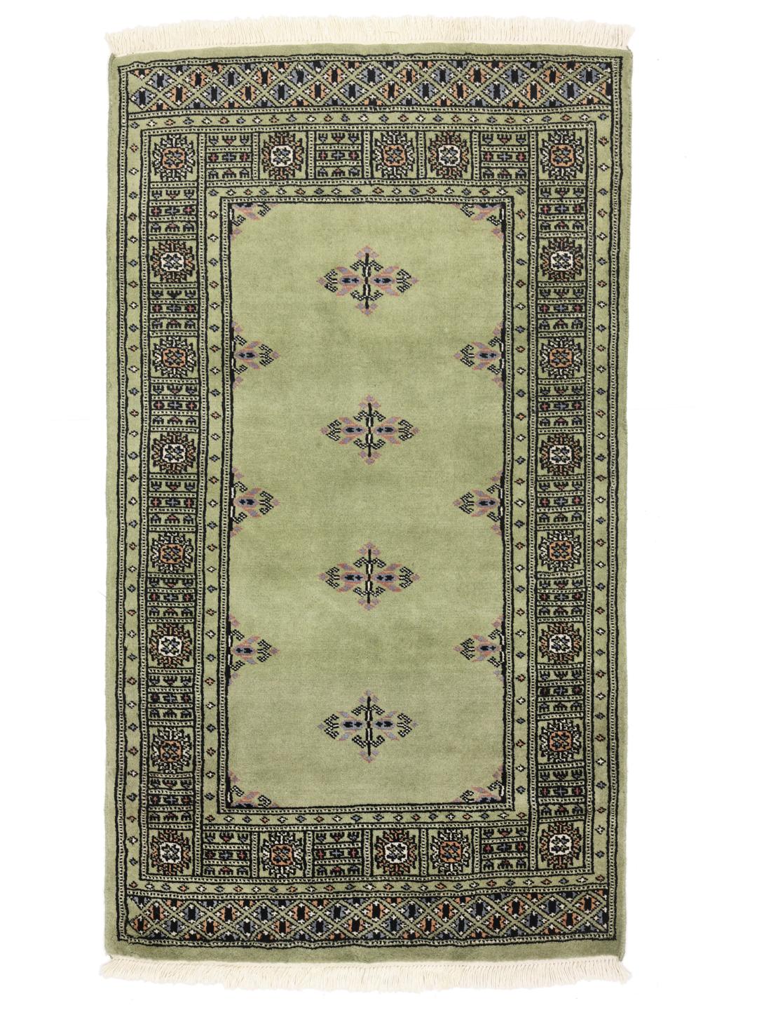 Handmade wool rug from Pakistan in green