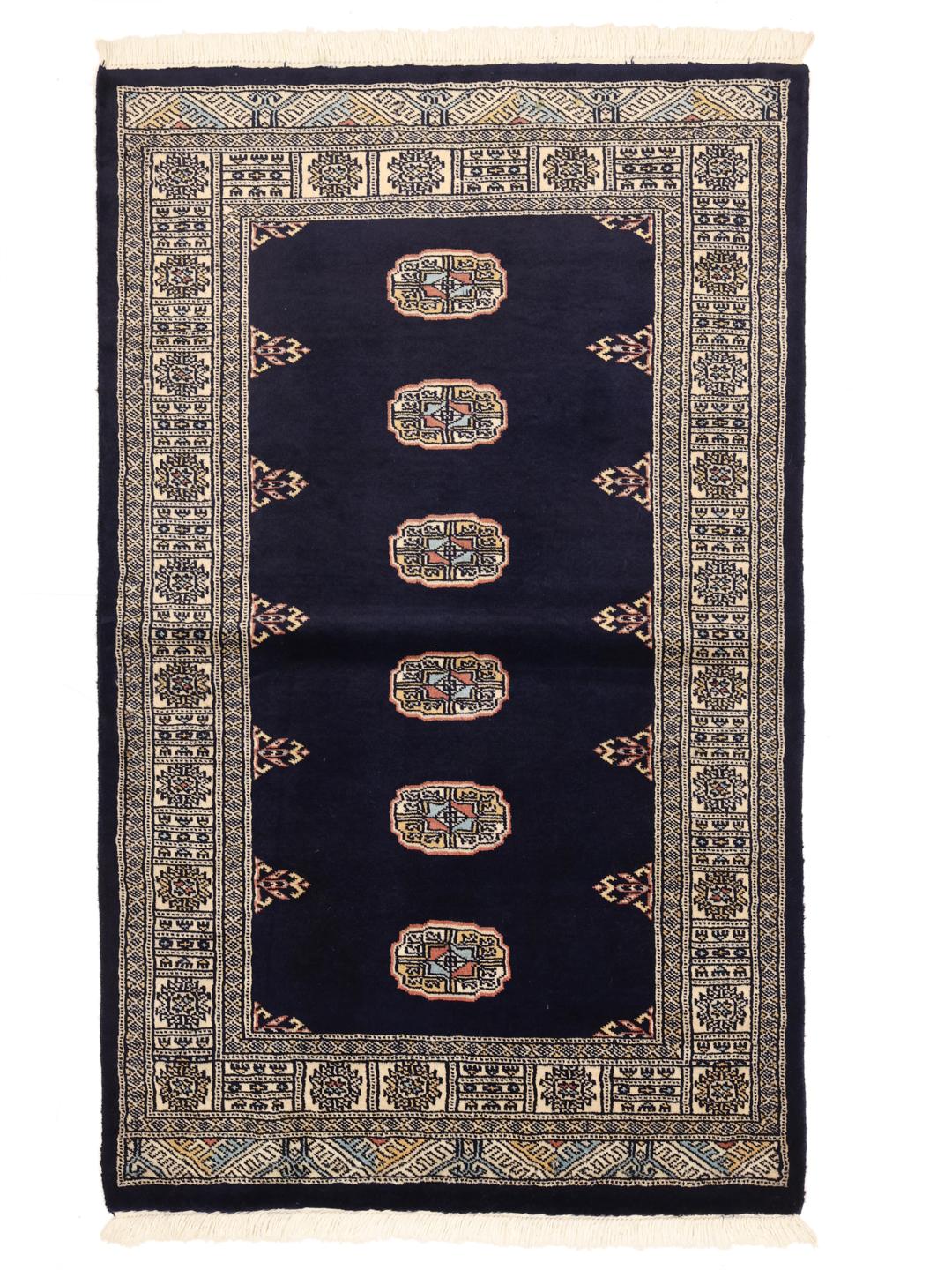 Handmade rug from Pakistan in dark blue