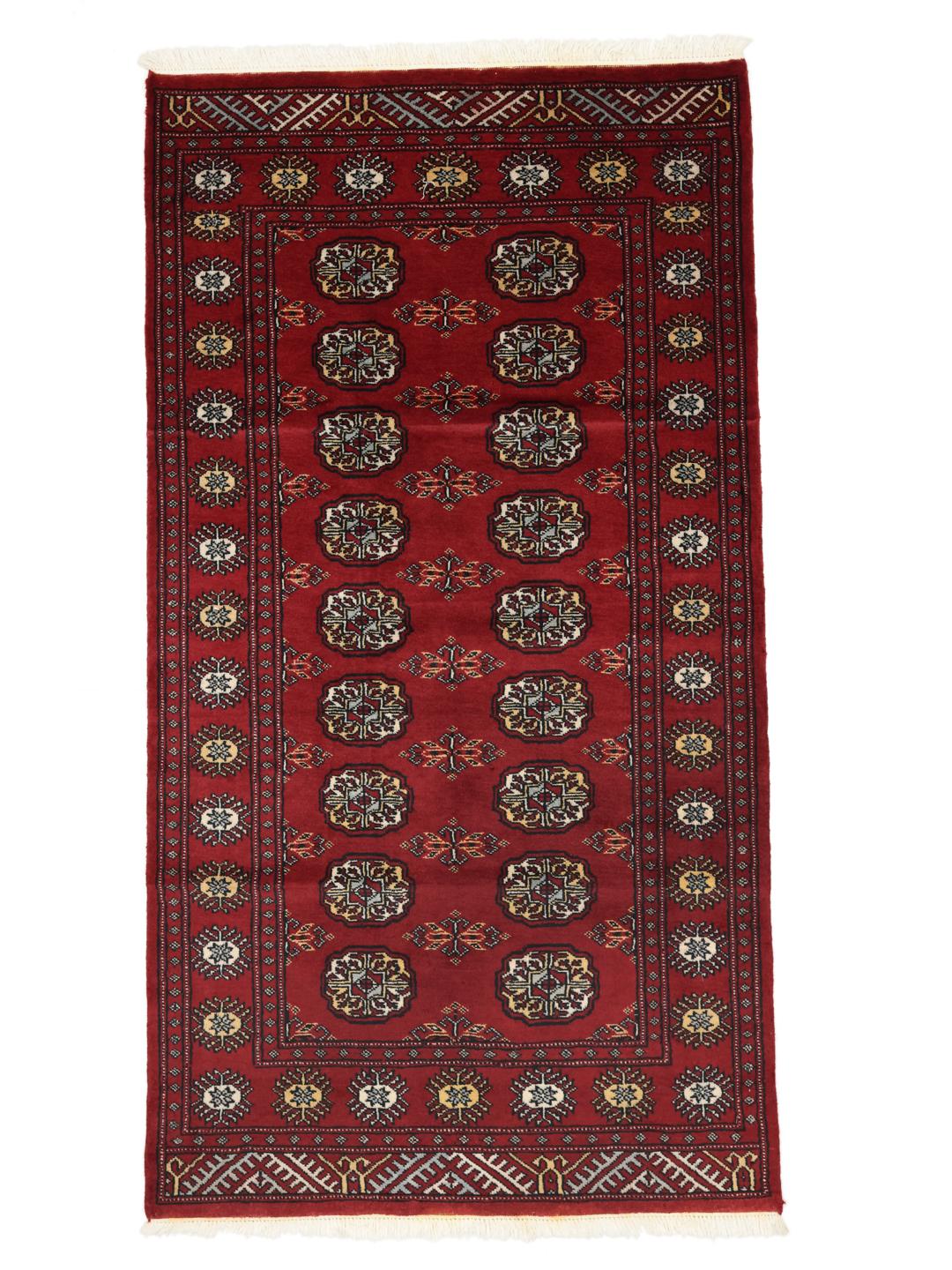 Handmade Pakistan red rug with traditional motifs