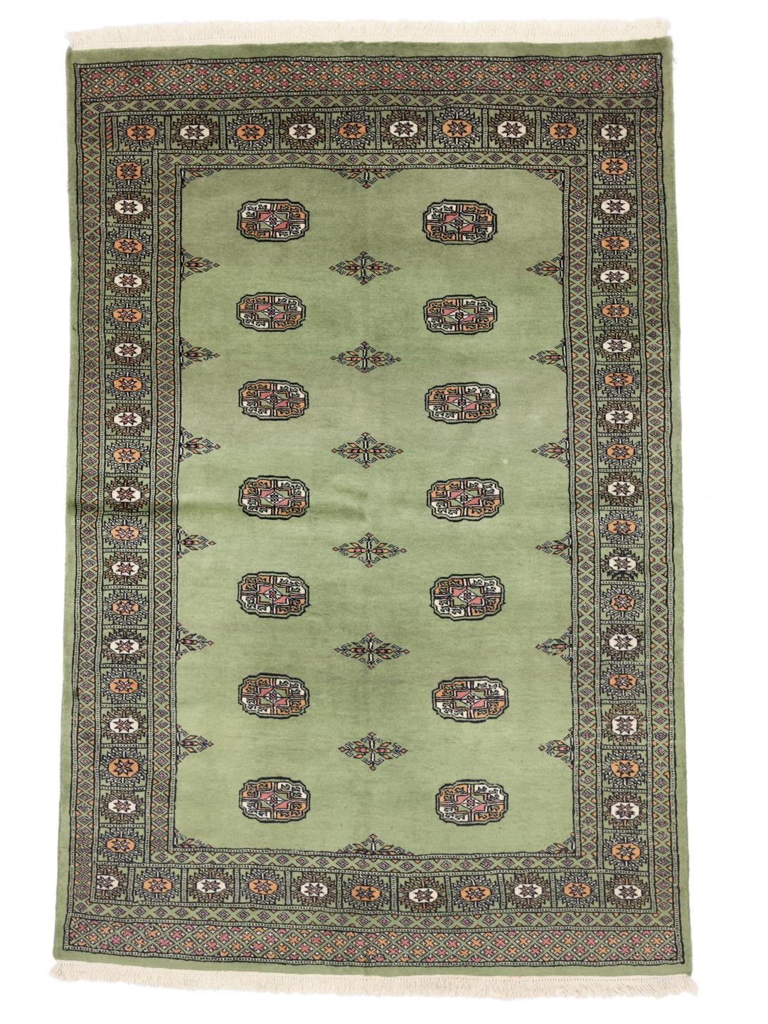 Tapis en laine pakistanaise noué à la main en vert