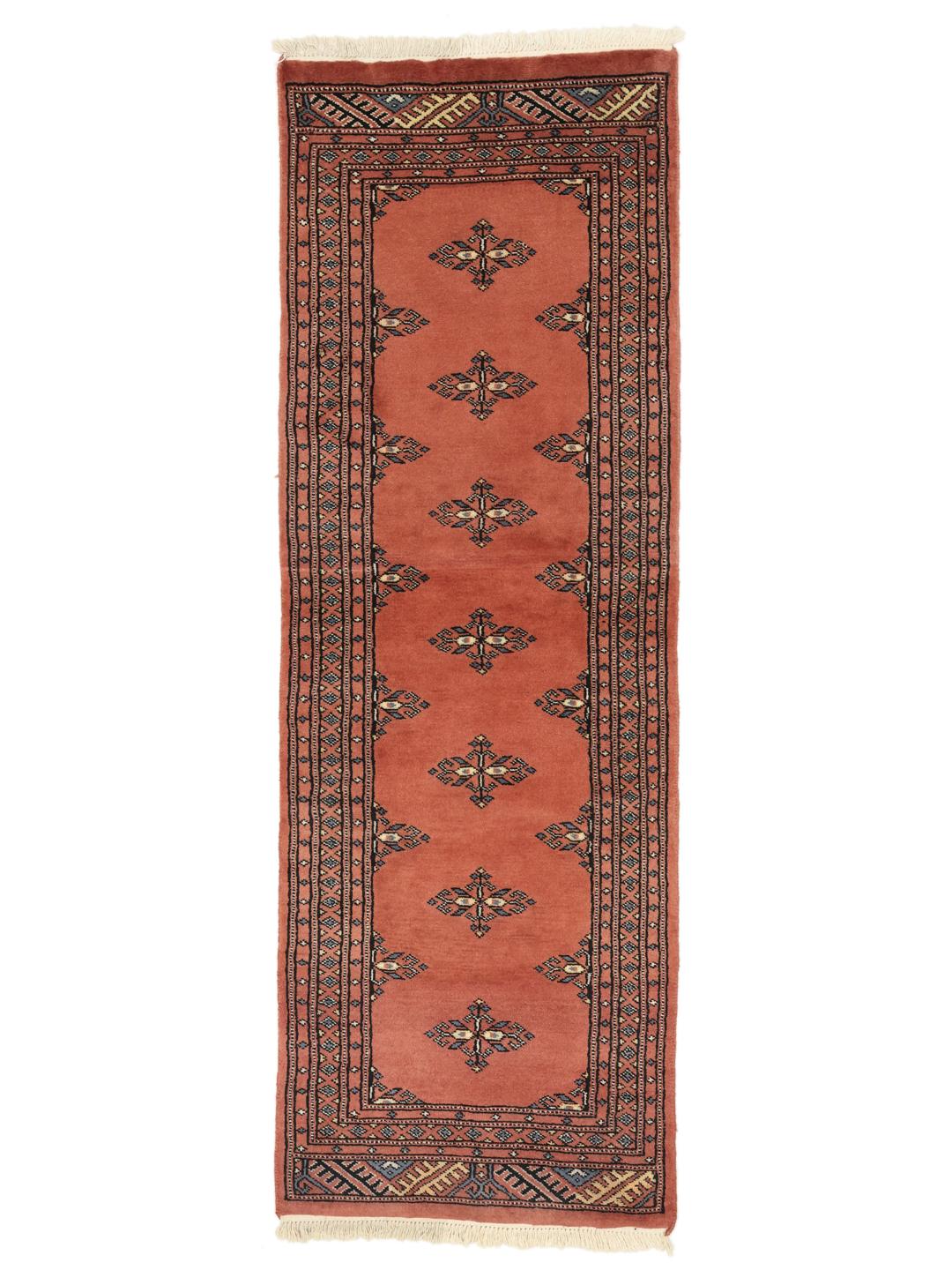 Handmade runner rug from Pakistan in red with traditional motifs