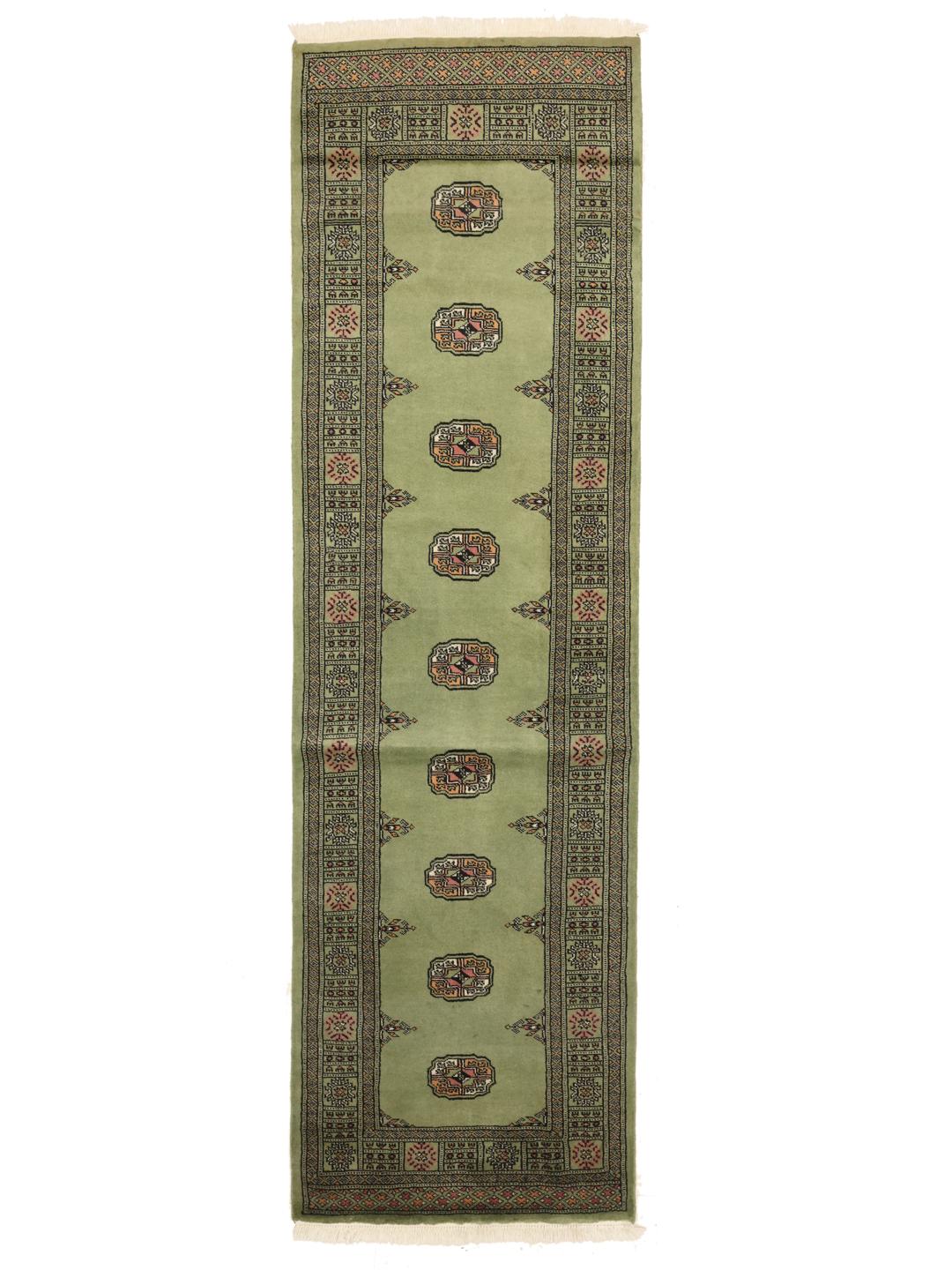 Runner rug from Pakistan in light-green with traditional patterns