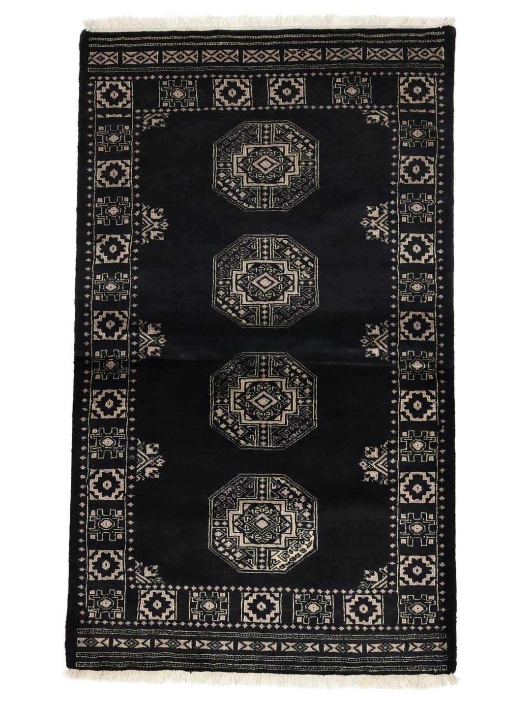 Hand-knotted Pakistani rug in black with traditional motifs