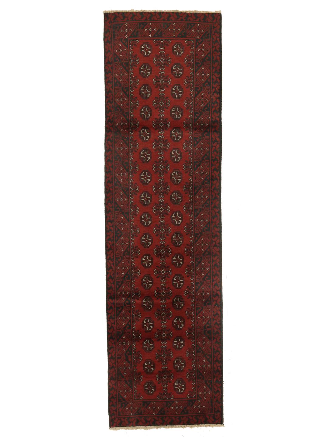 Tapis couloir afghan rouge avec des motifs traditionnels